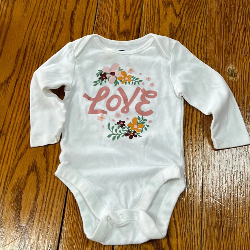 Old Navy white infant girls onsie.Long sleeve w/floral graphic & Love on front
